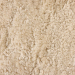 Contours and cantilevers define this Seventies-inspired dining chair. A woven sculptural frame of natural rattan bolsters textural shearling cushions for max comfort.As fans of wabi sabi materials at Amethyst, we love the warm modern inspired Katrine Dining Chair - Beige Shorn Shearling. Amethyst Home provides interior design, new home construction design consulting, vintage area rugs, and lighting in the San Diego metro area.