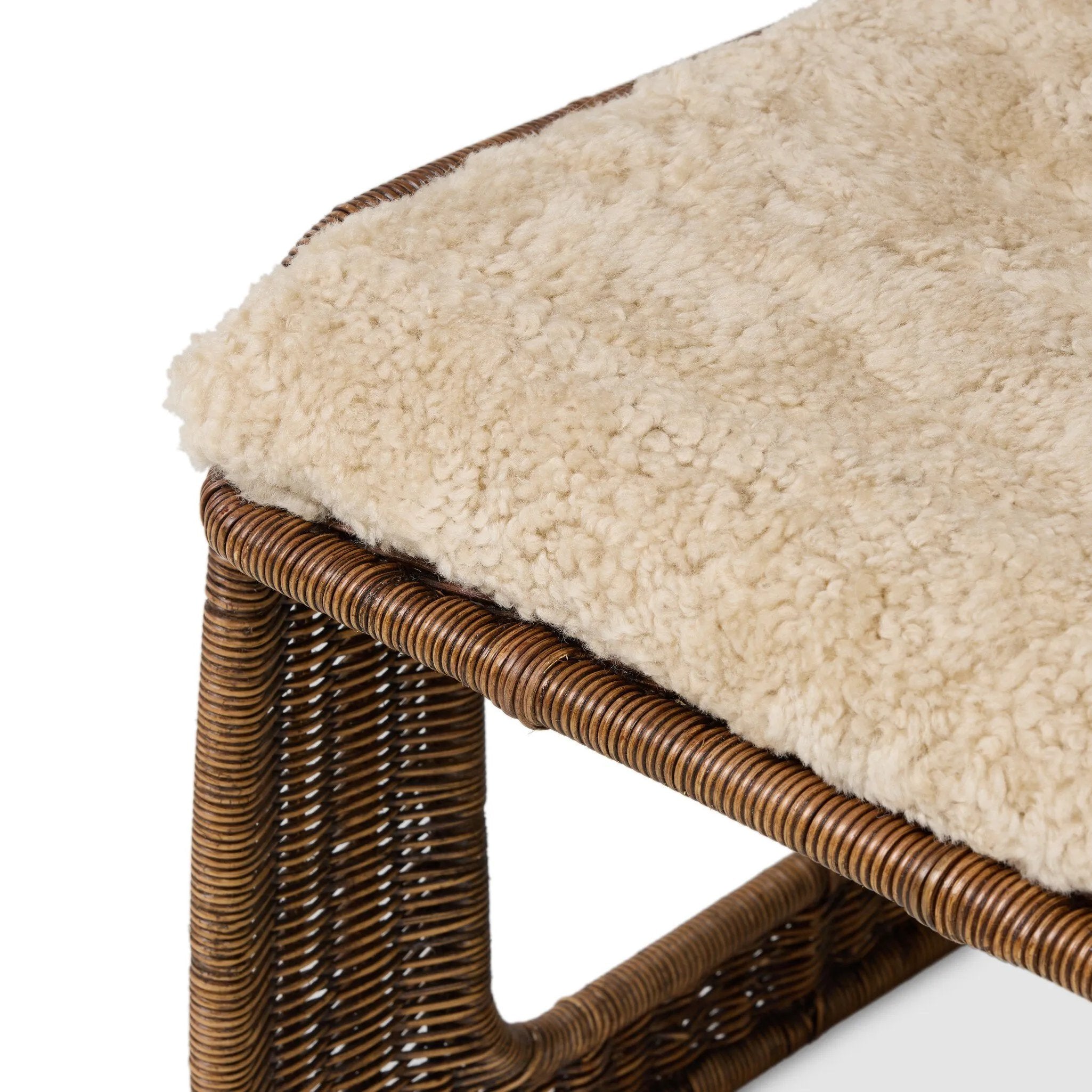 Contours and cantilevers define this Seventies-inspired dining chair. A woven sculptural frame of natural rattan bolsters textural shearling cushions for max comfort.As fans of wabi sabi materials at Amethyst, we love the warm modern inspired Katrine Dining Chair - Beige Shorn Shearling. Amethyst Home provides interior design, new home construction design consulting, vintage area rugs, and lighting in the Winter Garden metro area.