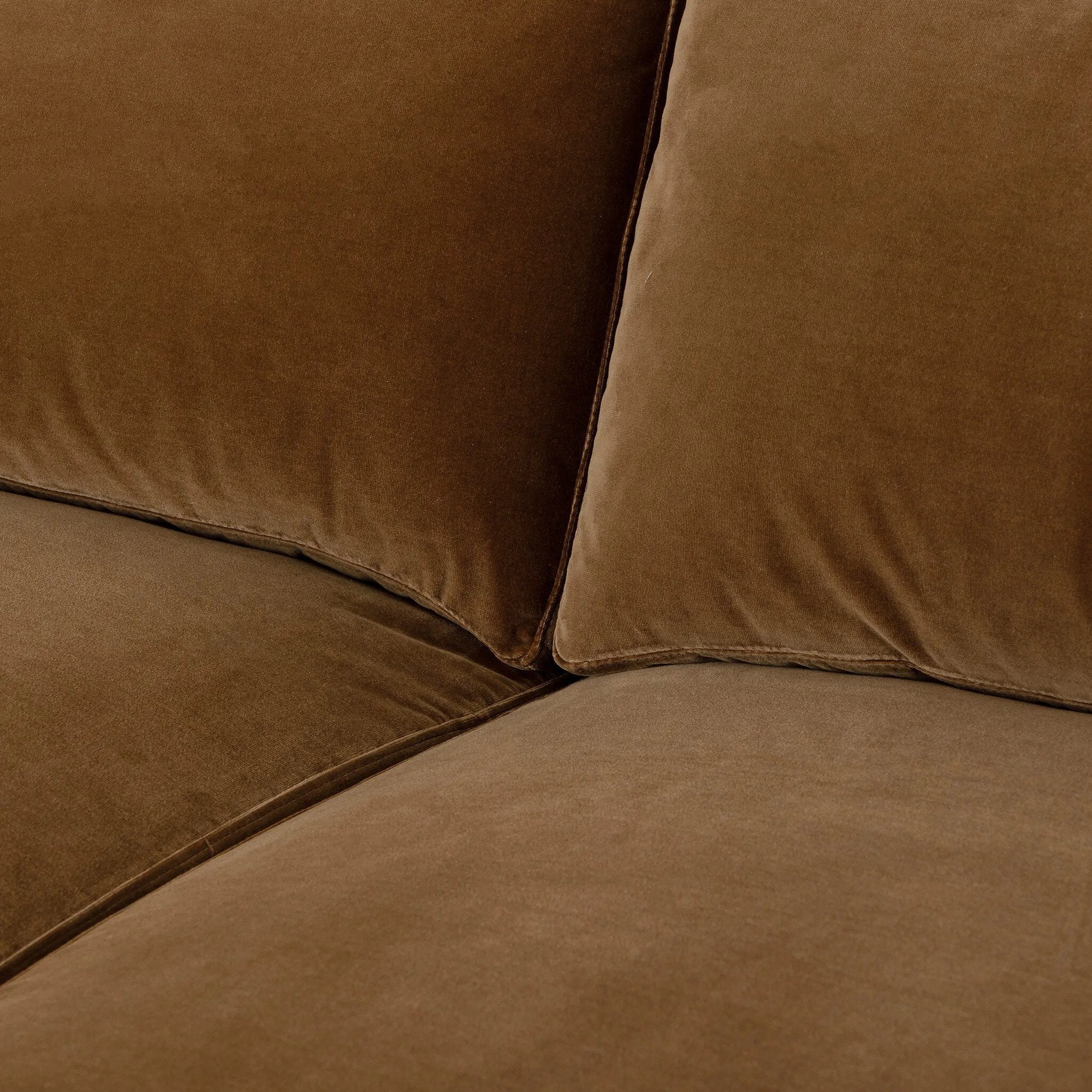 Float-style this unique sofa in a room to show off design details like sleek lines and rear cutouts. Designed with S spring construction, foam and fiber seat cushioning and loose feather-blend back cushions. Upholstered in a soft, velvety cotton in a warm ochre hue. Amethyst Home provides interior design, new home construction design consulting, vintage area rugs, and lighting in the Charlotte metro area.