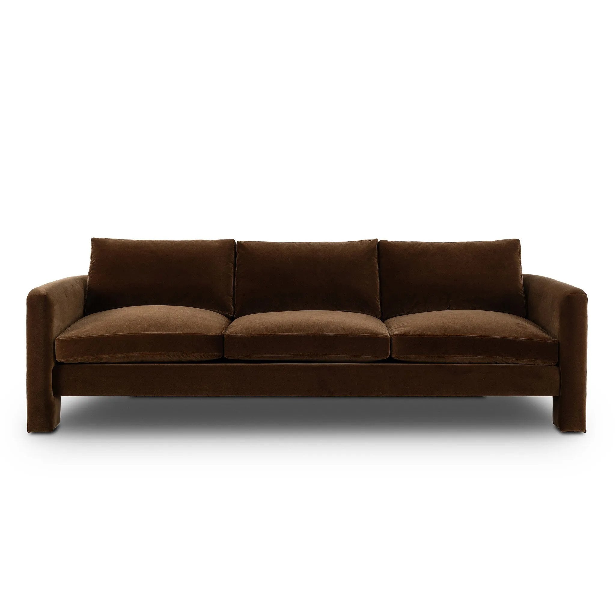 Float-style this unique sofa in a room to show off design details like sleek lines and rear cutouts. Designed with S spring construction, foam and fiber seat cushioning and loose feather-blend back cushions. Upholstered in a soft, velvety cotton in a rich chocolate brown Amethyst Home provides interior design, new home construction design consulting, vintage area rugs, and lighting in the Houston metro area.