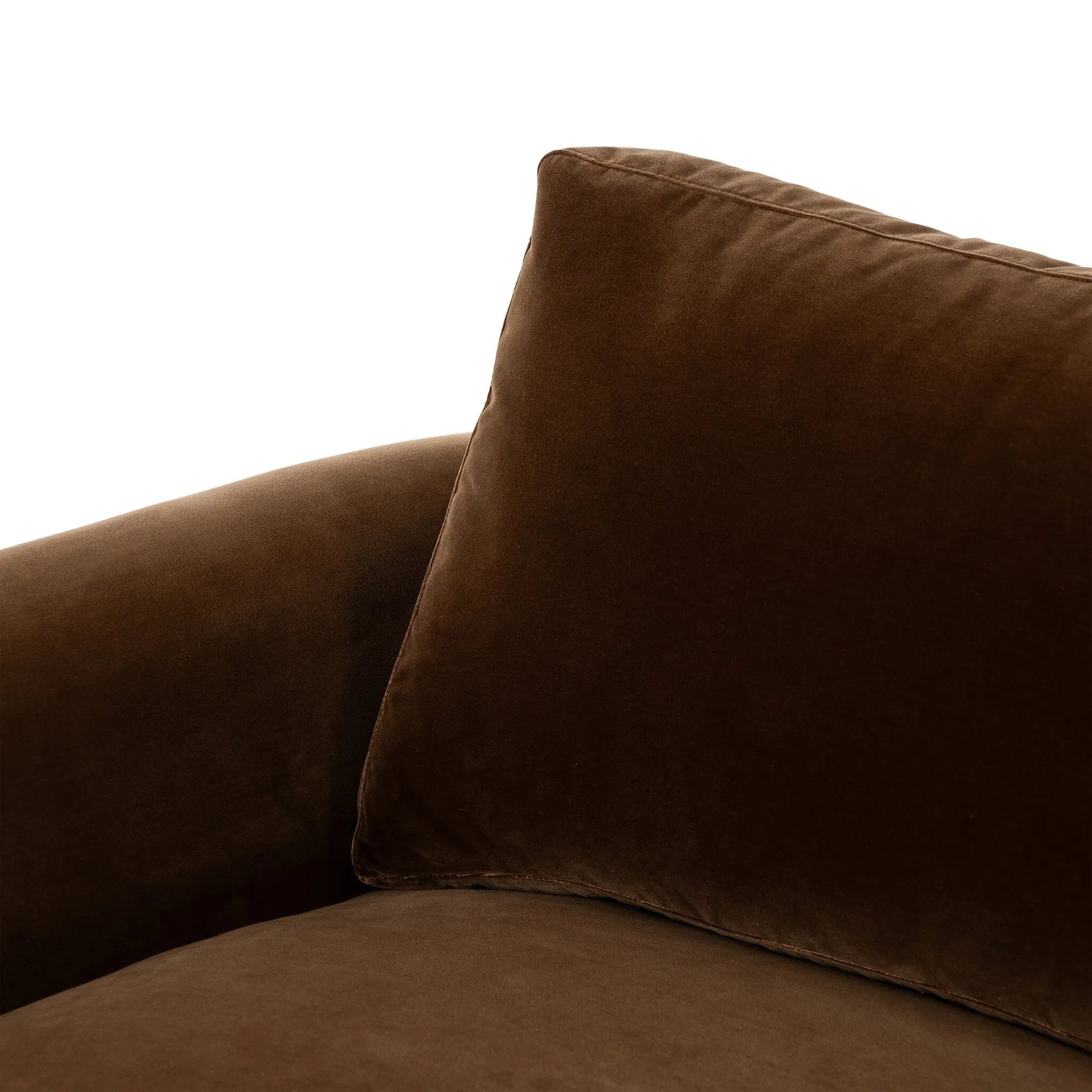 Float-style this unique sofa in a room to show off design details like sleek lines and rear cutouts. Designed with S spring construction, foam and fiber seat cushioning and loose feather-blend back cushions. Upholstered in a soft, velvety cotton in a rich chocolate brown Amethyst Home provides interior design, new home construction design consulting, vintage area rugs, and lighting in the Kansas City metro area.