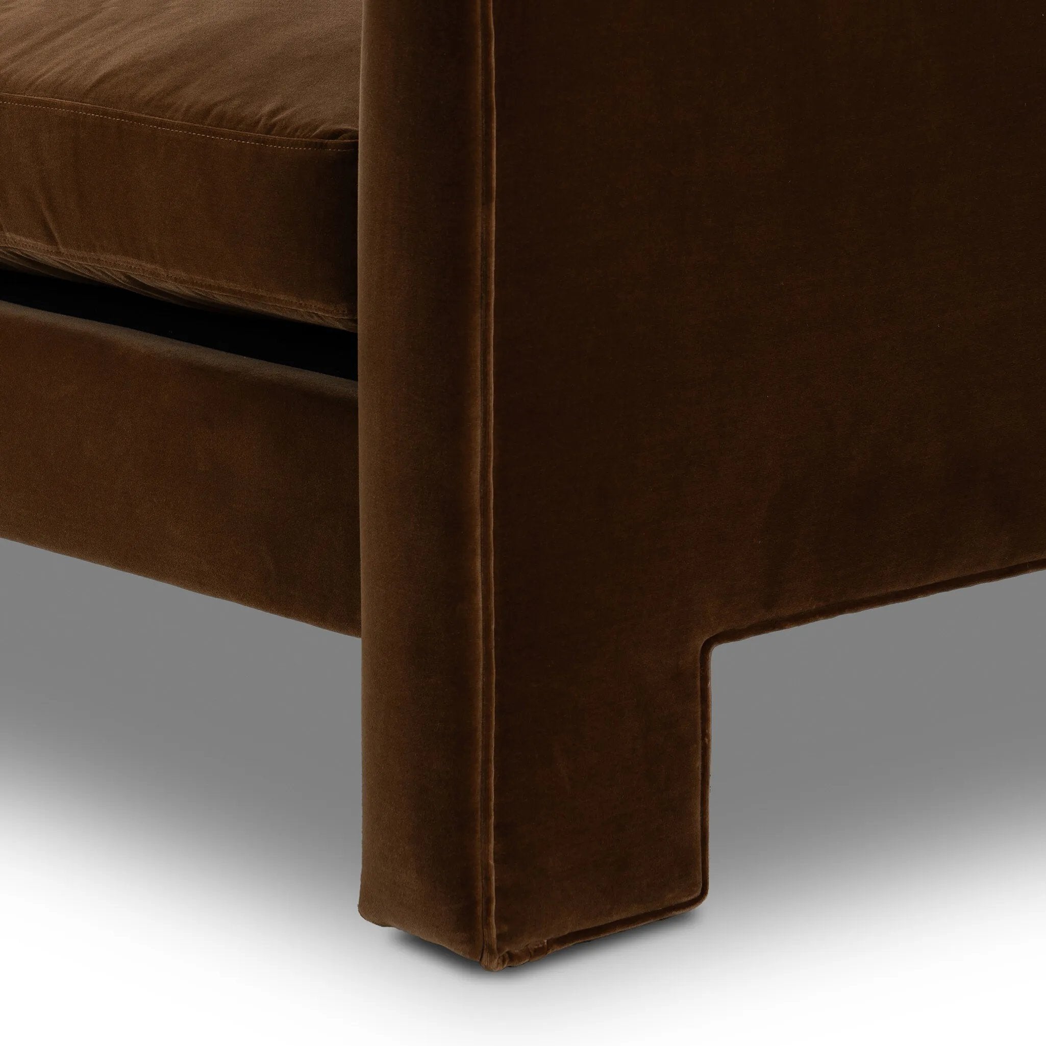 Float-style this unique sofa in a room to show off design details like sleek lines and rear cutouts. Designed with S spring construction, foam and fiber seat cushioning and loose feather-blend back cushions. Upholstered in a soft, velvety cotton in a rich chocolate brown Amethyst Home provides interior design, new home construction design consulting, vintage area rugs, and lighting in the San Diego metro area.