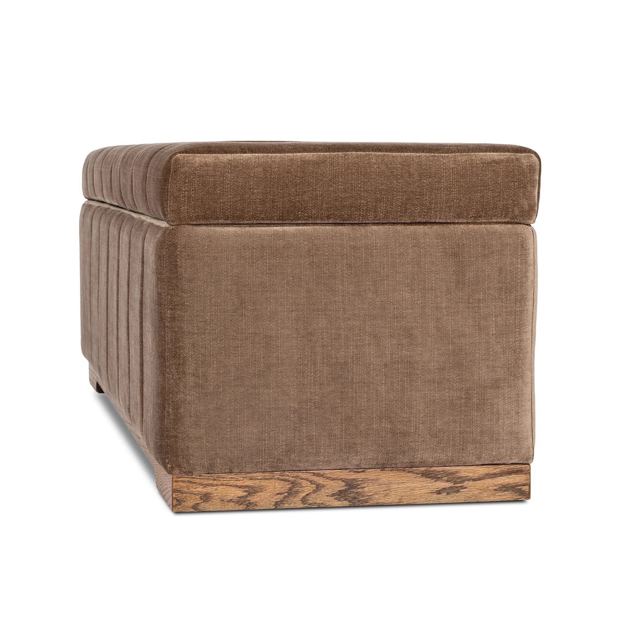 Picture this contemporary yet timeless trunk at the foot of your bed, for storage of extra linens, clothing or throw pillows. This soft, structured piece features a velvety fabric with vertical channel tufting. All grounded by a solid oak base. Amethyst Home provides interior design, new home construction design consulting, vintage area rugs, and lighting in the Dallas metro area.