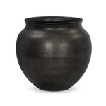 Cast aluminum featuring thousands of small, hammered details adds traditional flair to this outdoor-safe vessel, inspired by copper work found in Mexico. Finished in an antique bronze that's dark and sophisticated.As lovers of organic modern materials at Amethyst, we love the optimistic inspired Kavya Planter. Amethyst Home provides interior design, new home construction design consulting, vintage area rugs, and lighting in the Monterey metro area.