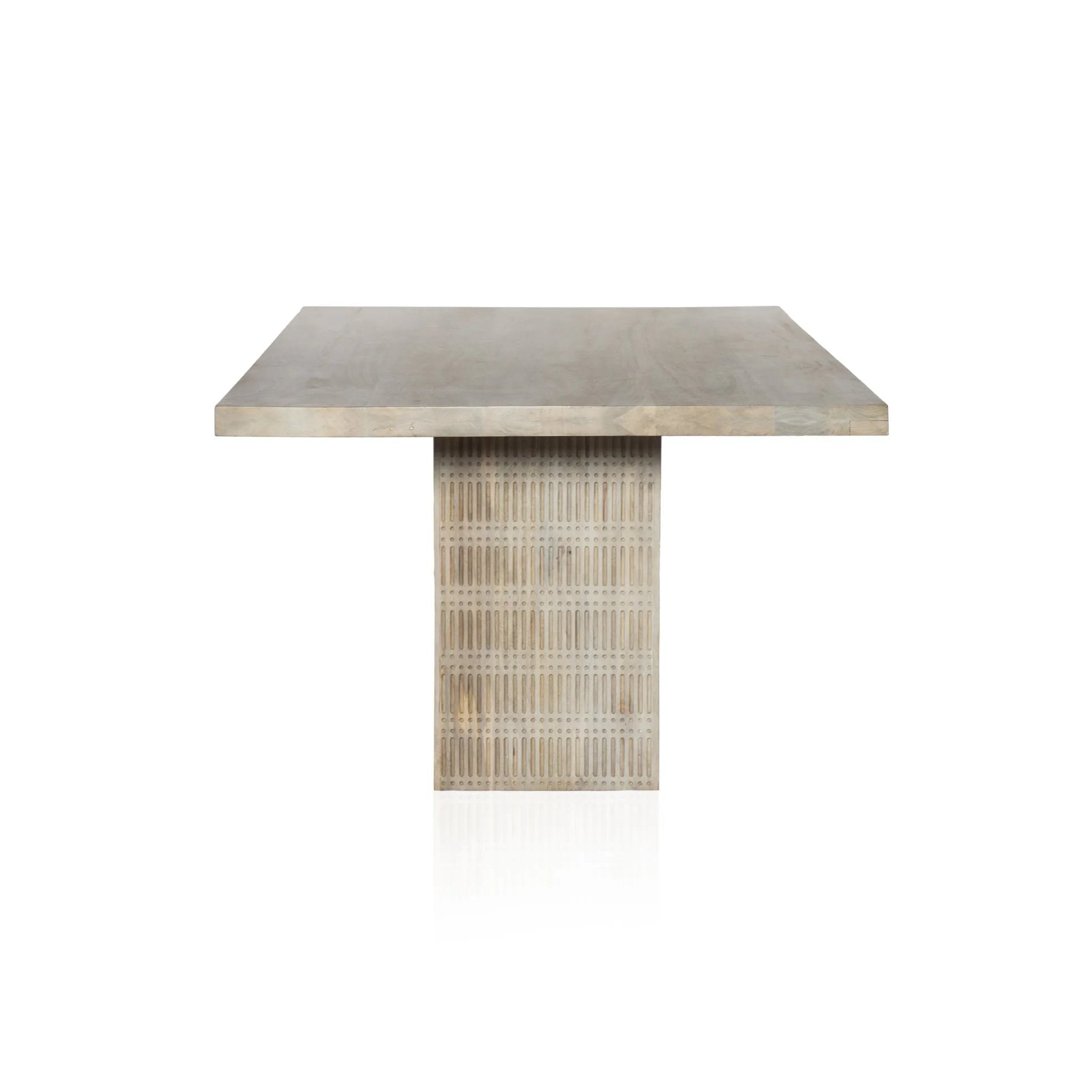 Unique linear carving with an artisan slant. Mango wood is finished in a light wash, highlighting texture and craftsmanship alike. Seats eight comfortably Amethyst Home provides interior design, new home construction design consulting, vintage area rugs, and lighting in the Boston metro area.