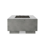 This outdoor fire table is a welcoming centerpiece designed for gathering. Made from glass-reinforced concrete, each piece is naturally finished with deep tones of pewter and dark grey. The monolithic shape is completed with lavastones in the center, bringing together a bold, monochromatic look. Amethyst Home provides interior design, new home construction design consulting, vintage area rugs, and lighting in the Calabasas metro area.