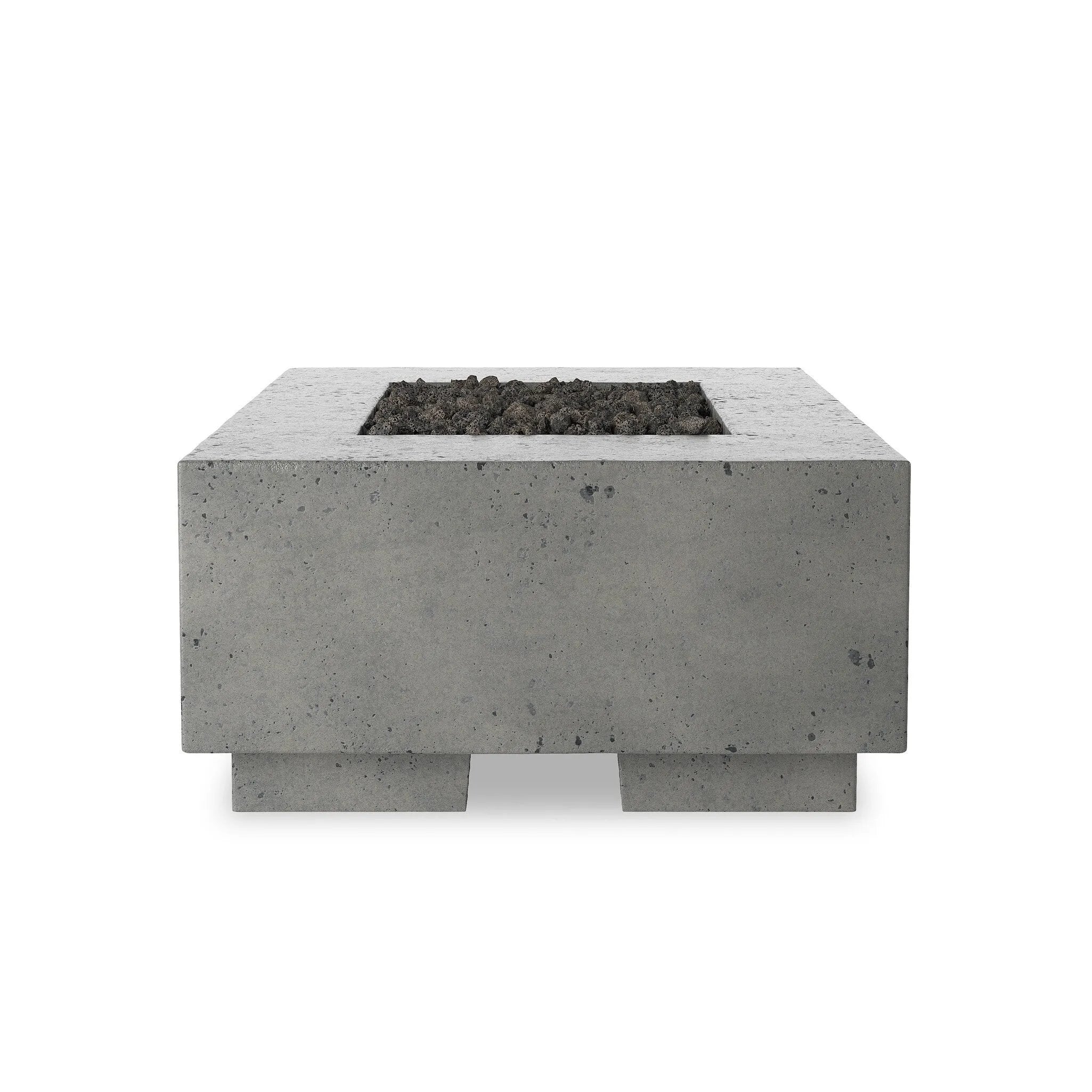 This outdoor fire table is a welcoming centerpiece designed for gathering. Made from glass-reinforced concrete, each piece is naturally finished with deep tones of pewter and dark grey. The monolithic shape is completed with lavastones in the center, bringing together a bold, monochromatic look. Amethyst Home provides interior design, new home construction design consulting, vintage area rugs, and lighting in the Calabasas metro area.