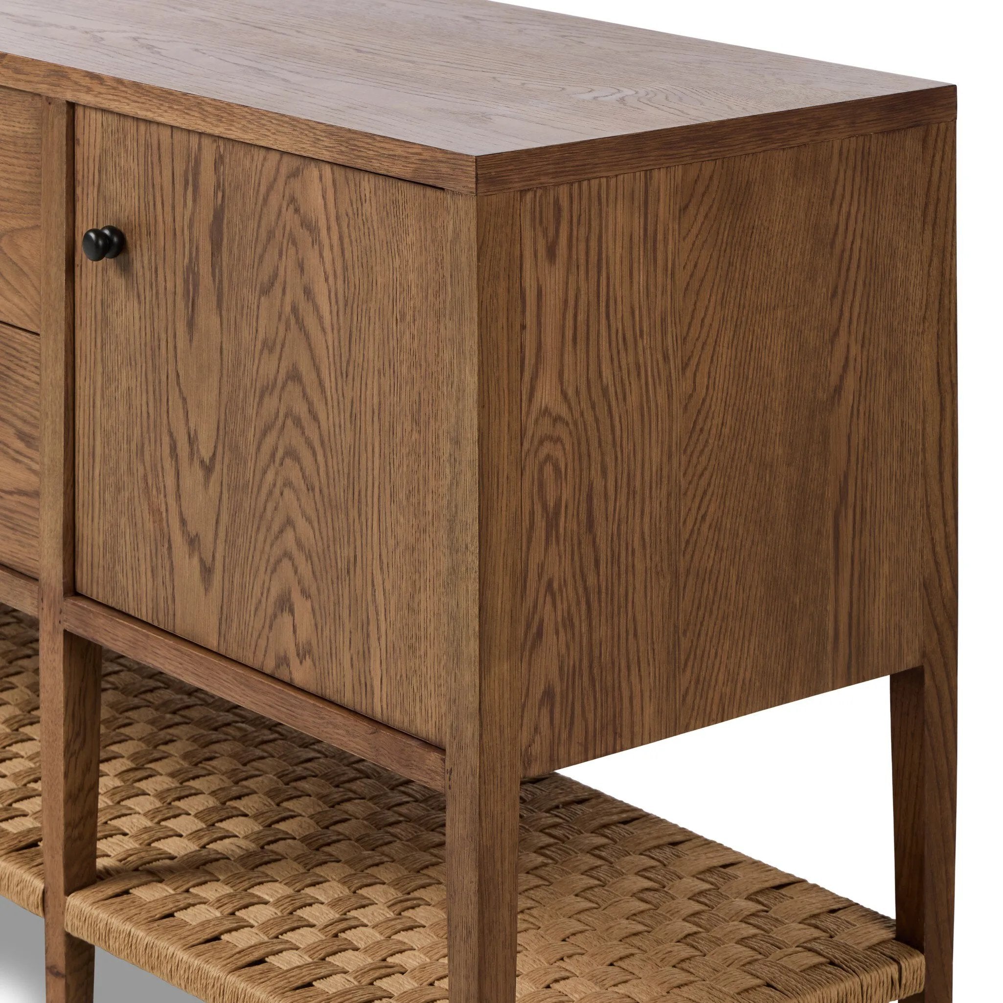 Add a coastal element to your living space with this organic-spirited media console. A woven paper cord shelf in a checkered pattern brings texture to a warm oak frame and tapered legs. Rear cutouts for cord management.As fans of clean materials at Amethyst, we love the optimistic inspired Kenzo Media Console - Warm Natural Oak Veneer. Amethyst Home provides interior design, new home construction design consulting, vintage area rugs, and lighting in the Alpharetta metro area.