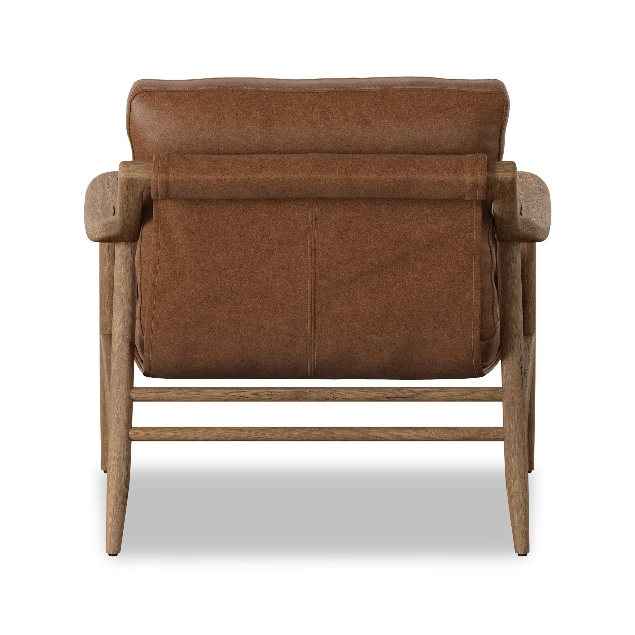 Made with thick-cut top-grain leather with a plump, pronounced grain, a sling-style chair features feather- and fiber-blend cushions for comfort, with clean boxing detailing. Between tapered oak legs, stretchers shape a slight arch, for an intriguing design detail Amethyst Home provides interior design, new home construction design consulting, vintage area rugs, and lighting in the Houston metro area.