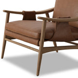 Made with thick-cut top-grain leather with a plump, pronounced grain, a sling-style chair features feather- and fiber-blend cushions for comfort, with clean boxing detailing. Between tapered oak legs, stretchers shape a slight arch, for an intriguing design detail Amethyst Home provides interior design, new home construction design consulting, vintage area rugs, and lighting in the Washington metro area.