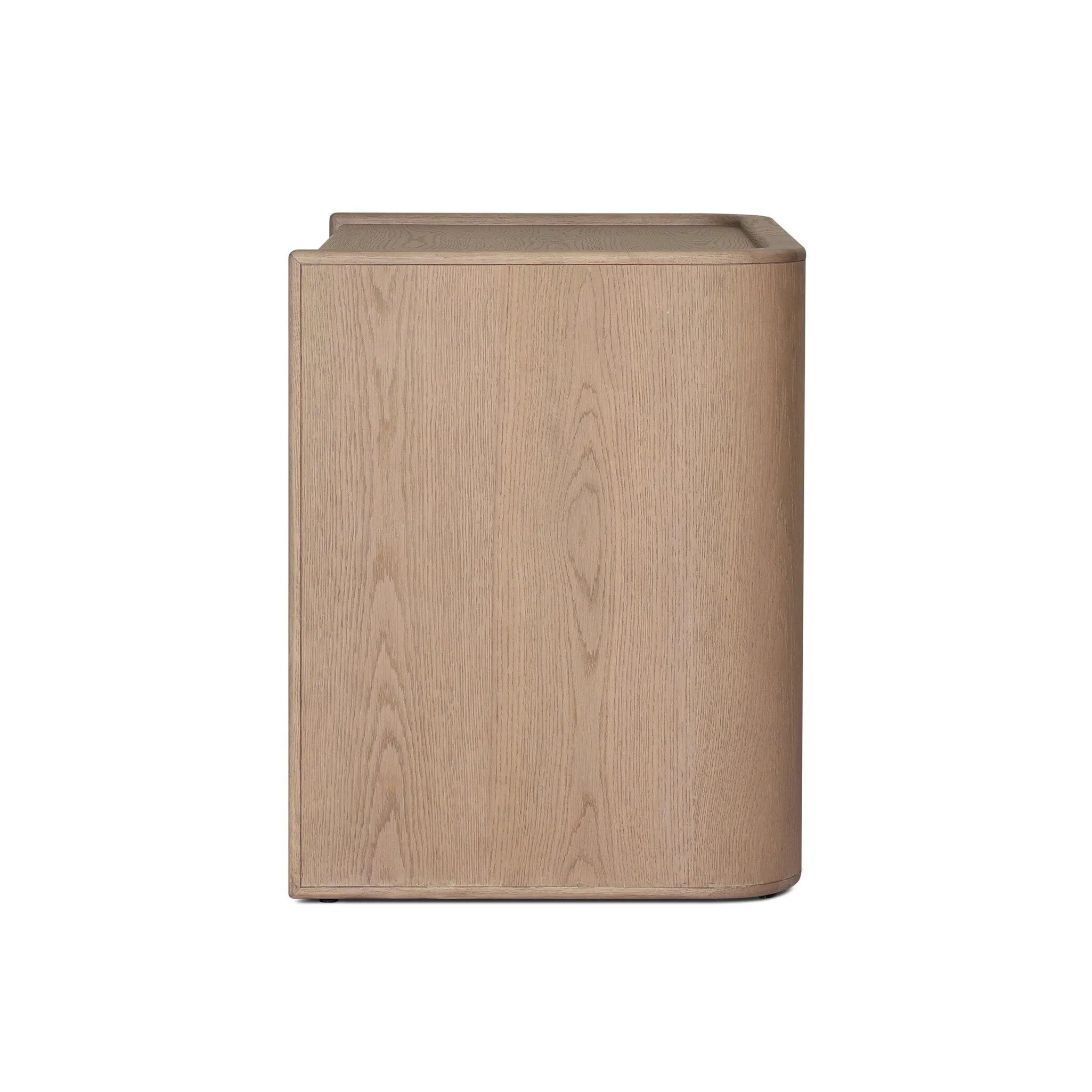 Featuring Kiran Sandy Oak Veneer Nightstand by Four Hands at Amethyst Home. Bring storage to your bedside with a monochromatic nightstand of sandy oak and painted linen, with split-circle iron hardware. A spacious interior features removable shelving to custom suit your needs. Overall Dimensions: 30.00"w x 20.00"d x 25.00"h. Amethyst Home provides interior design, new home construction design consulting, vintage area rugs, and lighting in the Monterey metro area.