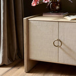 Featuring Kiran Sandy Oak Veneer Nightstand by Four Hands at Amethyst Home. Bring storage to your bedside with a monochromatic nightstand of sandy oak and painted linen, with split-circle iron hardware. A spacious interior features removable shelving to custom suit your needs. Overall Dimensions: 30.00"w x 20.00"d x 25.00"h. Amethyst Home provides interior design, new home construction design consulting, vintage area rugs, and lighting in the Scottsdale metro area.