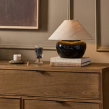 As lovers of modern aesthetics at Amethyst, we love the warm modern inspired Kiyo Table Lamp - Glossy Black Ceramic. This item pairs well with other brands such as Ethnicraft and is perfect for modern homes Amethyst Home provides interior design, new home construction design consulting, vintage area rugs, and lighting in the Omaha metro area.