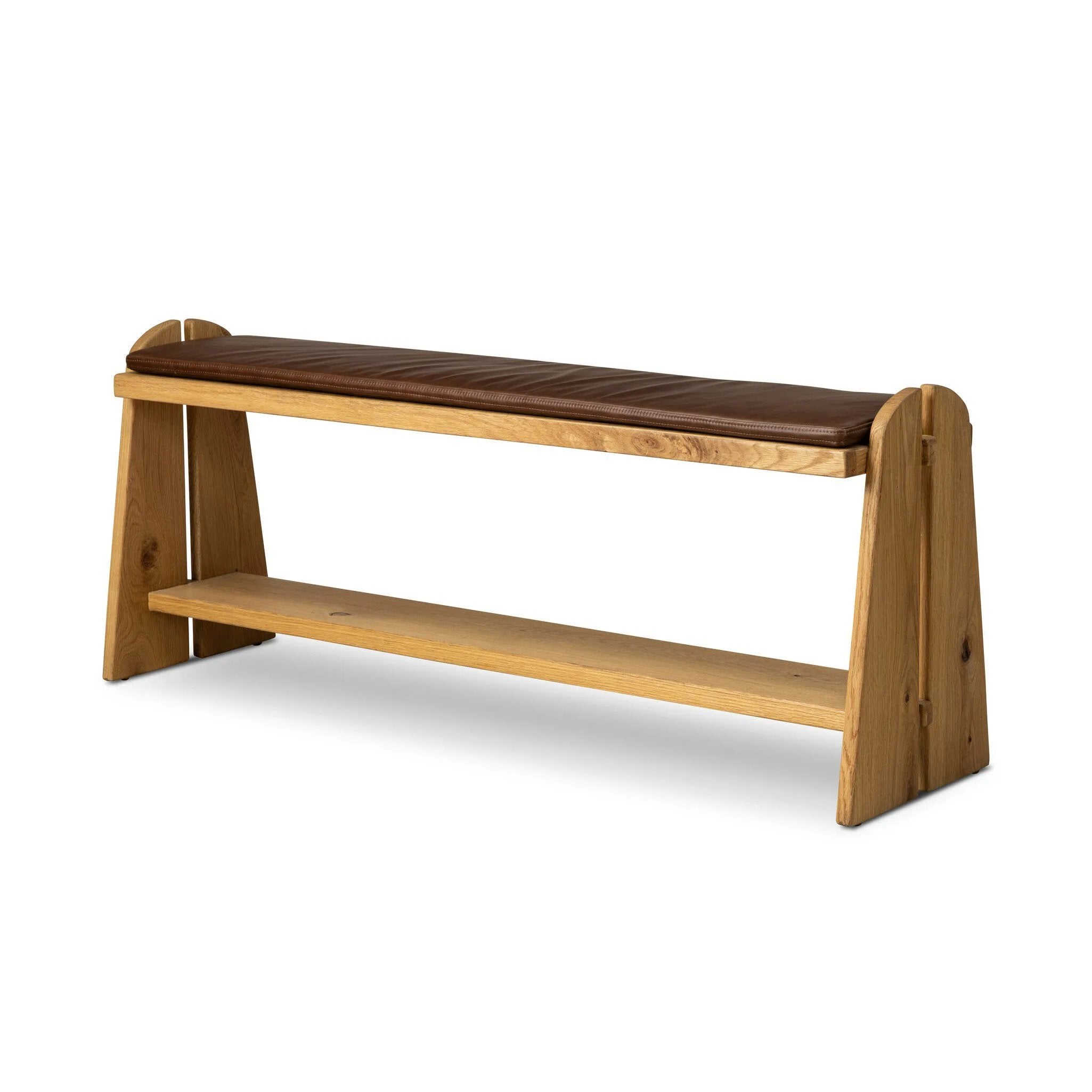 Style this versatile bench just about anywhere. A light, toasted oak frame shapes tapered paddle legs, with relief and split-leg detailing for a design-forward look. A thin layer of brown top-grain leather brings warmth and comfort to the whole look. Amethyst Home provides interior design, new home construction design consulting, vintage area rugs, and lighting in the Alpharetta metro area.