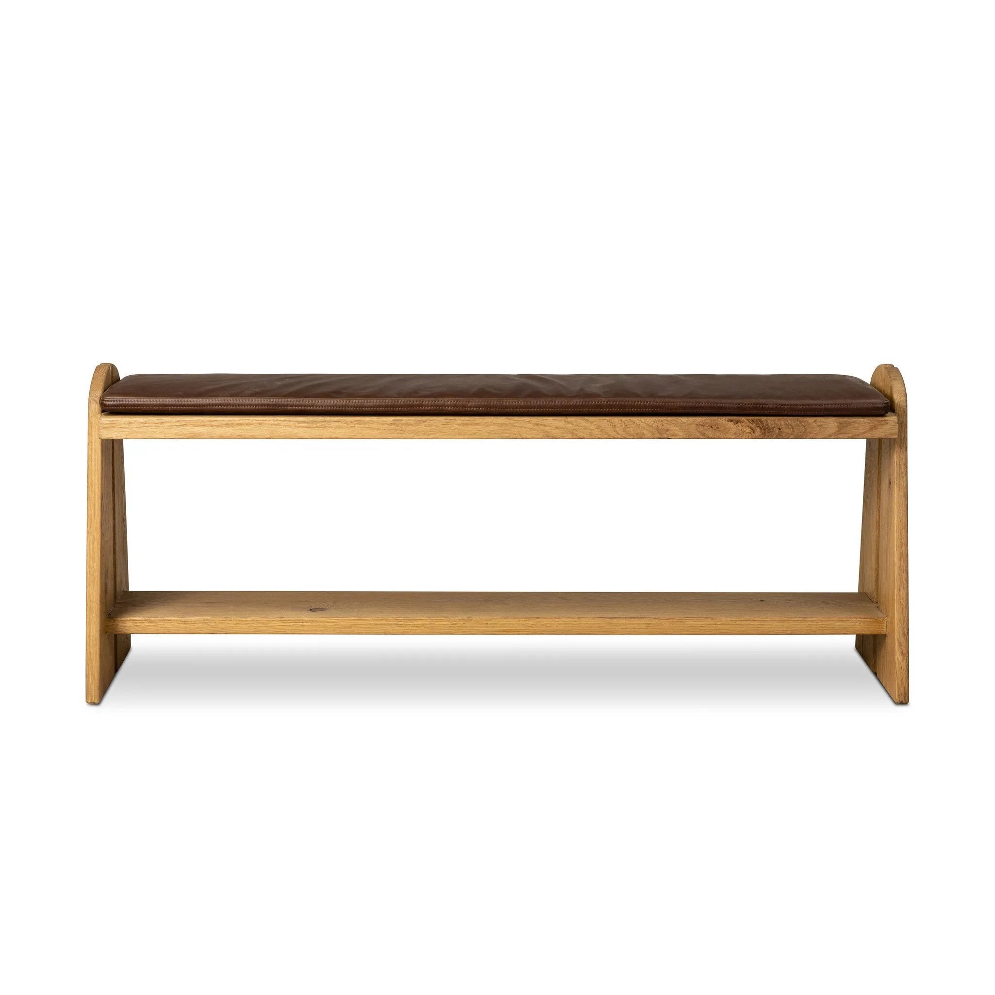 Style this versatile bench just about anywhere. A light, toasted oak frame shapes tapered paddle legs, with relief and split-leg detailing for a design-forward look. A thin layer of brown top-grain leather brings warmth and comfort to the whole look. Amethyst Home provides interior design, new home construction design consulting, vintage area rugs, and lighting in the Houston metro area.