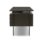 Featuring Lauren Charcoal Oak Resawn Veneer Desk by Four Hands at Amethyst Home. Made from resawn oak and oak veneer, a legal-style desk offers major storage with dual cabinetry, including file storage for legal and letter-size documents. A floating top and iron legs keep the look modern and light. This piece is designed in collaboration with Thomas Bina. . Amethyst Home provides interior design, new home construction design consulting, vintage area rugs, and lighting in the Des Moines metro area.