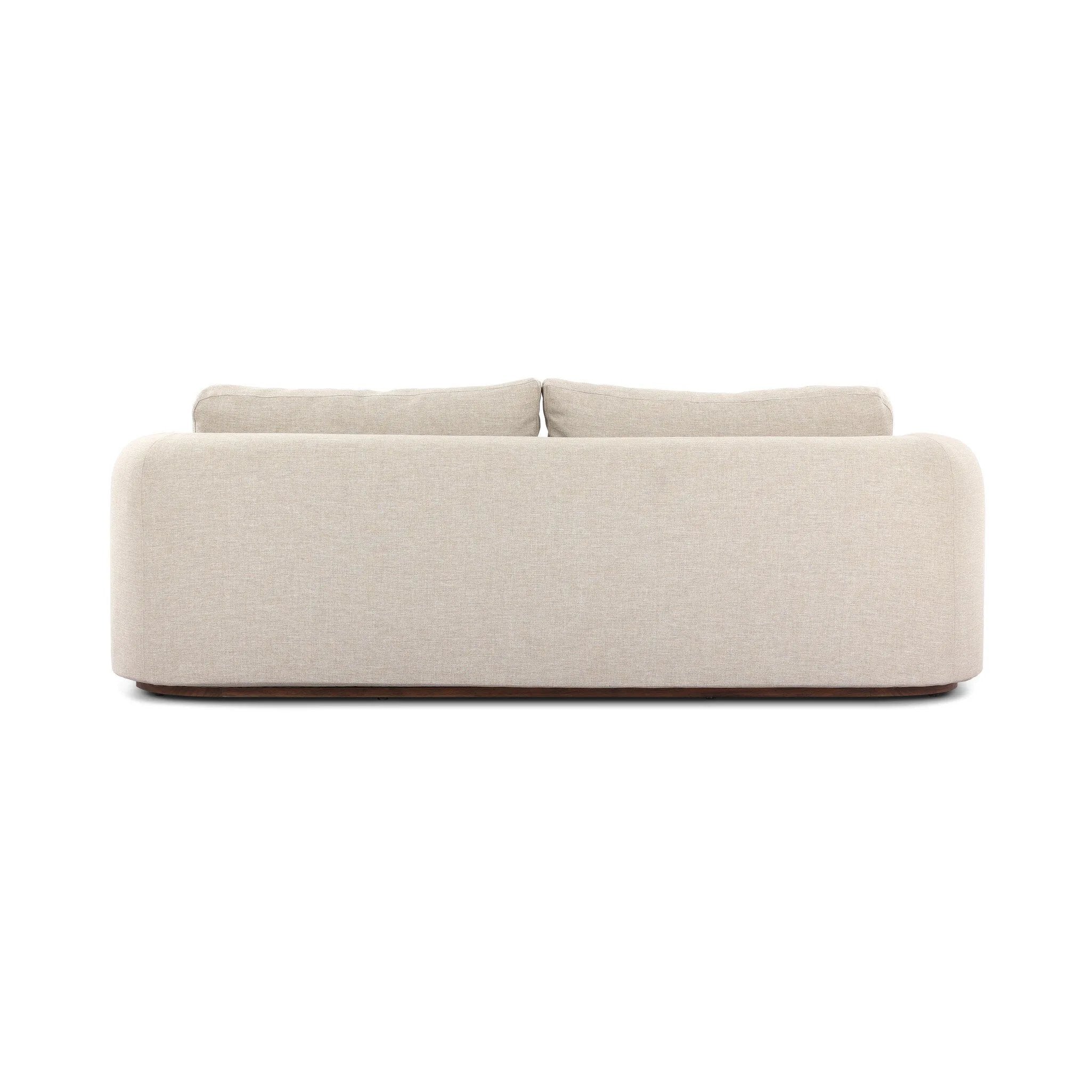 Featuring Lavine Alessi Buff Outdoor Sofa 94" by Four Hands at Amethyst Home. Settle into comfort outdoors. An inviting outdoor sofa features a rounded, inflated silhouette crafted from solid FSC®-certified teak. Finished in high-performance upholstery, with welcoming wide arms and loose back cushions for easy lounging. Cover or store indoors during inclement. Amethyst Home provides interior design, new home construction design consulting, vintage area rugs, and lighting in the Houston metro area.