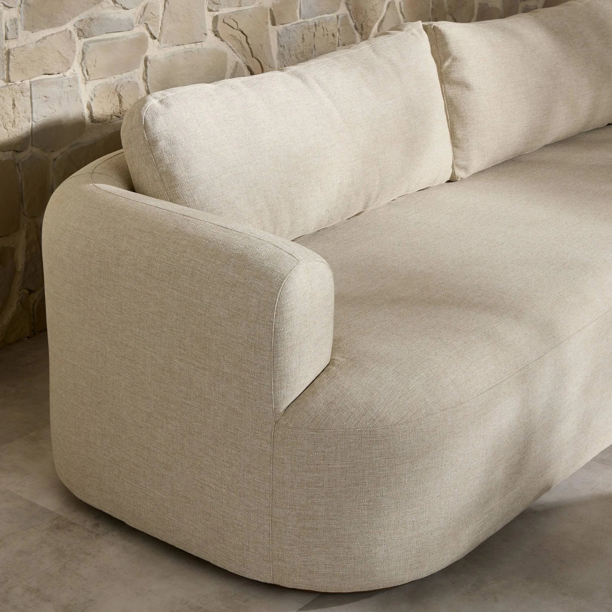 Featuring Lavine Alessi Buff Outdoor Sofa 94" by Four Hands at Amethyst Home. Settle into comfort outdoors. An inviting outdoor sofa features a rounded, inflated silhouette crafted from solid FSC®-certified teak. Finished in high-performance upholstery, with welcoming wide arms and loose back cushions for easy lounging. Cover or store indoors during inclemen. Amethyst Home provides interior design, new home construction design consulting, vintage area rugs, and lighting in the Portland metro area.