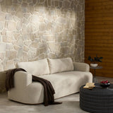 Featuring Lavine Alessi Buff Outdoor Sofa 94" by Four Hands at Amethyst Home. Settle into comfort outdoors. An inviting outdoor sofa features a rounded, inflated silhouette crafted from solid FSC®-certified teak. Finished in high-performance upholstery, with welcoming wide arms and loose back cushions for easy lounging. Cover or store indoors during inc. Amethyst Home provides interior design, new home construction design consulting, vintage area rugs, and lighting in the Winter Garden metro area.