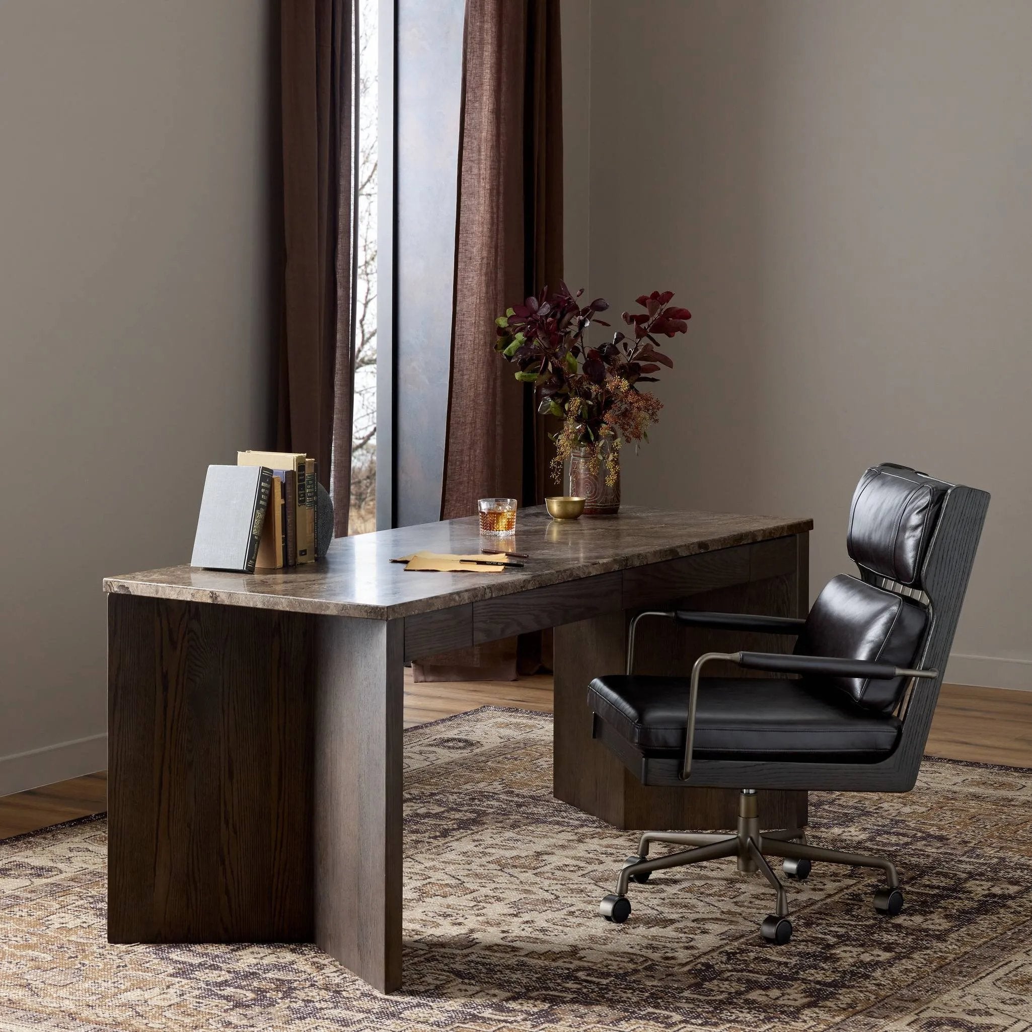 The traditional writing desk, elevated with mixed materials. Vein-rich marble tops an angular brown oak base, with two pencil drawers for storage Amethyst Home provides interior design, new home construction design consulting, vintage area rugs, and lighting in the San Diego metro area.