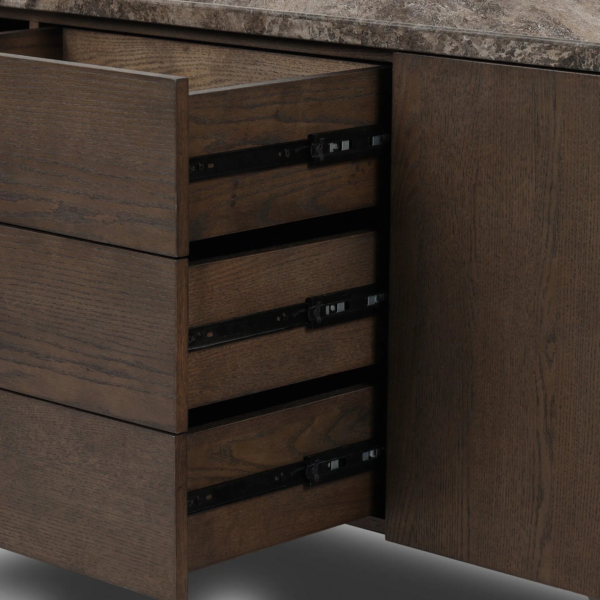 The traditional media console, elevated with mixed materials. Vein-rich marble tops an angular brown oak base, with three drawers flanked by cabinets for storage. Rear cutouts for cord management.As enthusiasts of wabi sabi design at Amethyst, we love the designer inspired Lawson Media Console. Amethyst Home provides interior design, new home construction design consulting, vintage area rugs, and lighting in the Washington metro area.