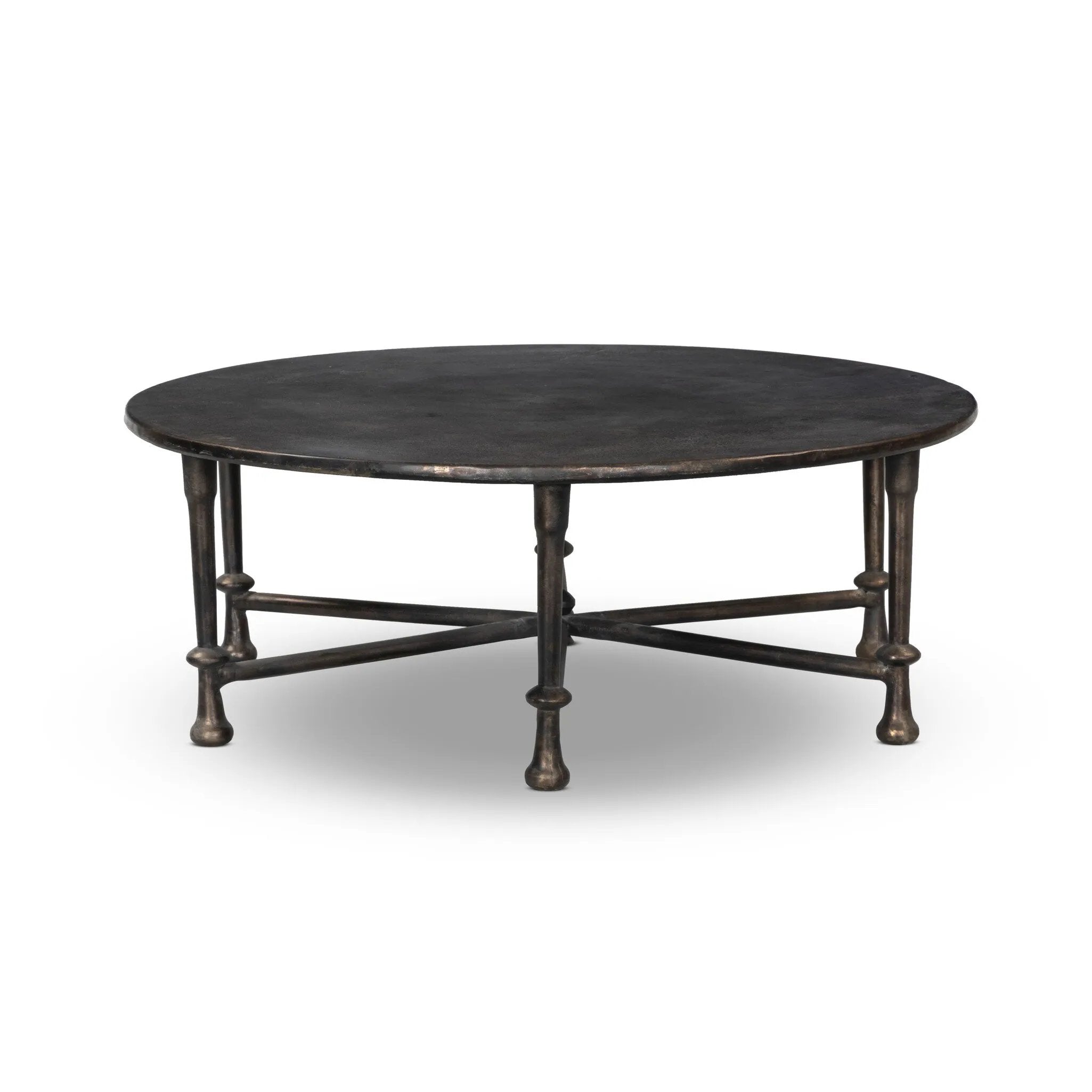 Cast aluminum shapes this statement outdoor coffee table. Each of the six legs features turned detailing, finished in a distressed bronze that highlights the subtle movement of the material. A design collaboration by Amber Lewis and Four Hands. This item has limited online distribution and may not be sold on websites without prior approval. Amethyst Home provides interior design, new home construction design consulting, vintage area rugs, and lighting in the Nashville metro area.