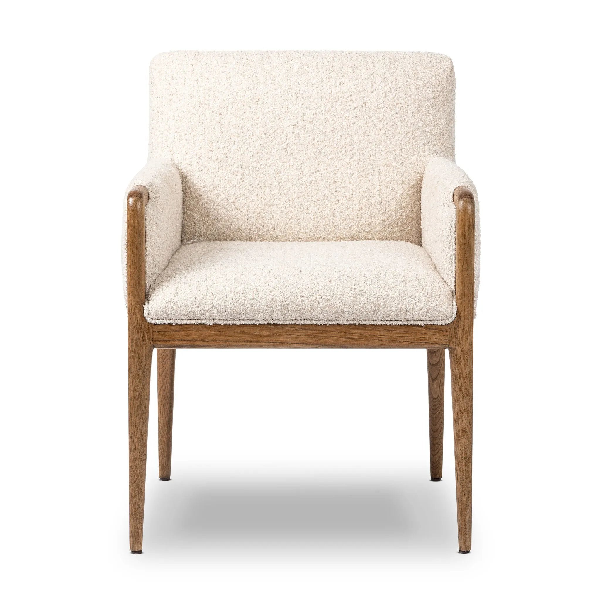 A box-profile dining chair that’s all about comfort. Exposed oak legs flow seamlessly into the chair's upholstered arms, for a seamless look. Performance fabrics are specially created to withstand spills, stains, high traffic and wear, ensuring long-term comfort and unmatched durability Amethyst Home provides interior design, new home construction design consulting, vintage area rugs, and lighting in the Los Angeles metro area.