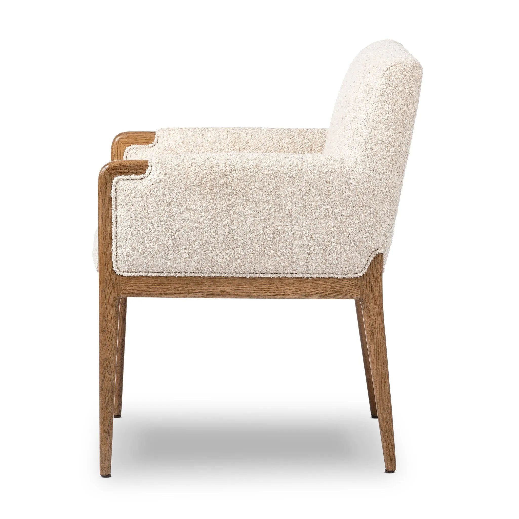Featuring Ledger Somerton Ash Dining Chair by Four Hands at Amethyst Home. A box-profile dining chair that’s all about comfort. Exposed oak legs flow seamlessly into the chair's upholstered arms, for a seamless look. Performance fabrics are specially created to withstand spills, stains, high traffic and wear, ensuring long-term comfort and unmatched dur. Amethyst Home provides interior design, new home construction design consulting, vintage area rugs, and lighting in the Winter Garden metro area.