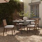 This outdoor dining table takes inspiration from French Art Deco design elements, with mirroring curves creating a sense of symmetry and fluid movement. Crafted from fully cast aluminum with a distressed bronze finish, complete with plenty of textural highs and lows to give the finish depth. Amethyst Home provides interior design, new home construction design consulting, vintage area rugs, and lighting in the Alpharetta metro area.