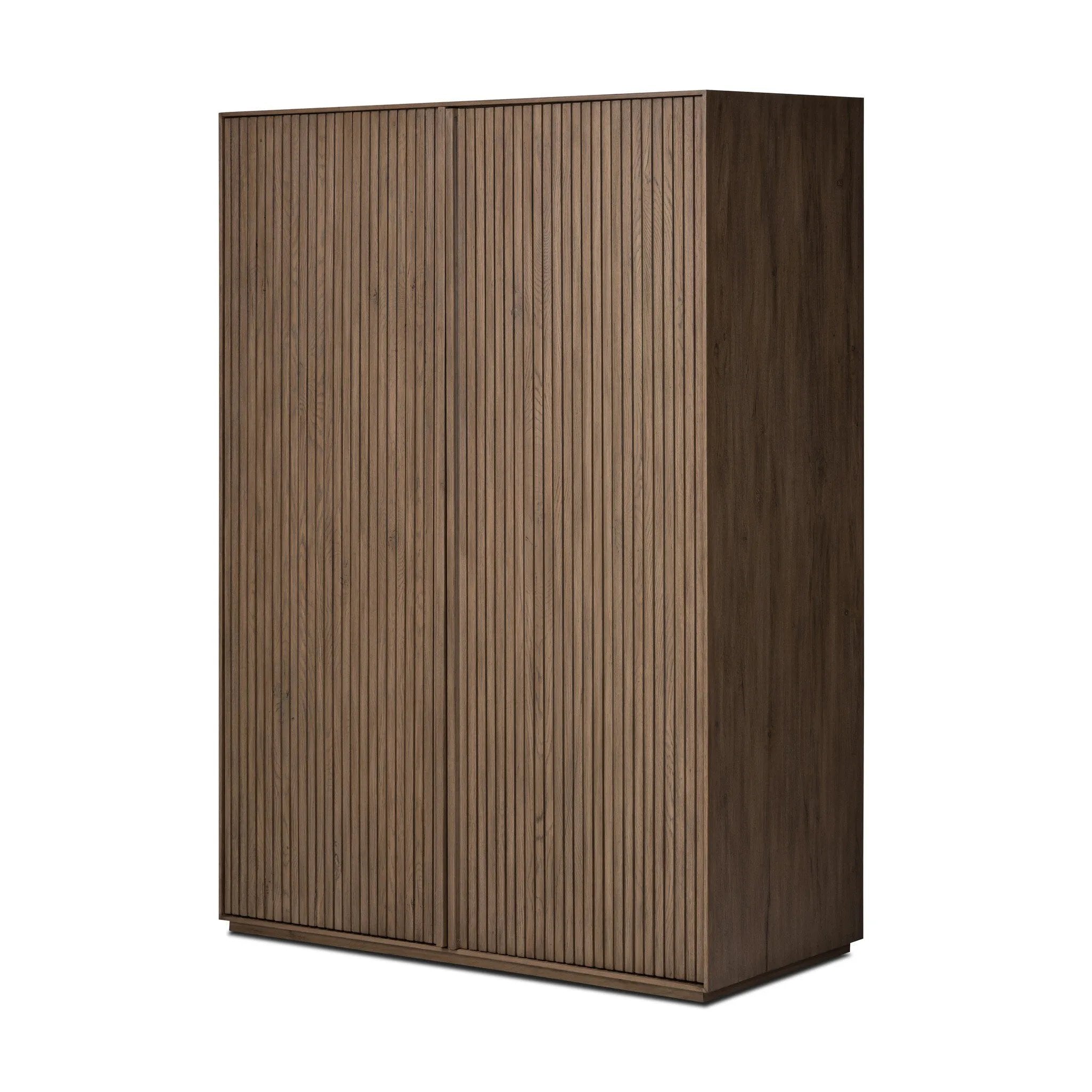Made from rustic-finished oak with a plinth-style base, clean angles and linear reeding define this midcentury-spirited cabinet. Fully finished interior for a beautiful look inside and out. Designed in partnership with longtime Four Hands collaborator Thomas Bina and Brazilian designer Ronald Sasson. Amethyst Home provides interior design, new home construction design consulting, vintage area rugs, and lighting in the Portland metro area.