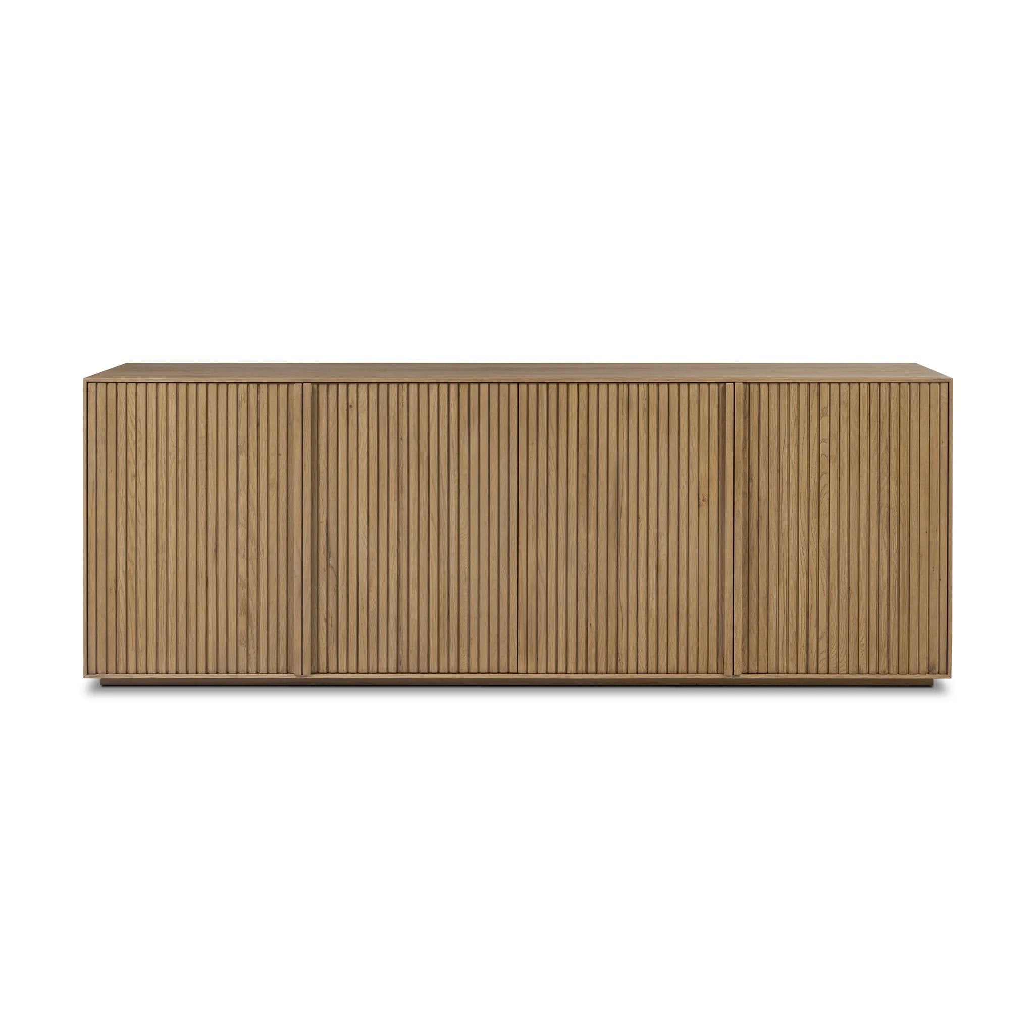 Made from rustic-finished oak with a plinth-style base, clean angles and linear reeding define this midcentury-spirited sideboard. Fully finished interior for a beautiful look inside and out. Designed in partnership with longtime Four Hands collaborator Thomas Bina and Brazilian designer Ronald Sasson Amethyst Home provides interior design, new home construction design consulting, vintage area rugs, and lighting in the Omaha metro area.