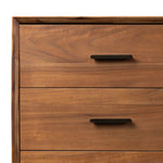 Make a subtle statement in your bedroom with a modern, architectural dresser. An exaggerated pedestal base of solid acacia supports a clean-lined case with nine roomy drawers. Iron hardware in an aged bronze finish the look.As enthusiasts of clean materials at Amethyst, we love the designer inspired Lilas 9 Drawer Dresser - Saddle Tan Veneer. Amethyst Home provides interior design, new home construction design consulting, vintage area rugs, and lighting in the Laguna Beach metro area.