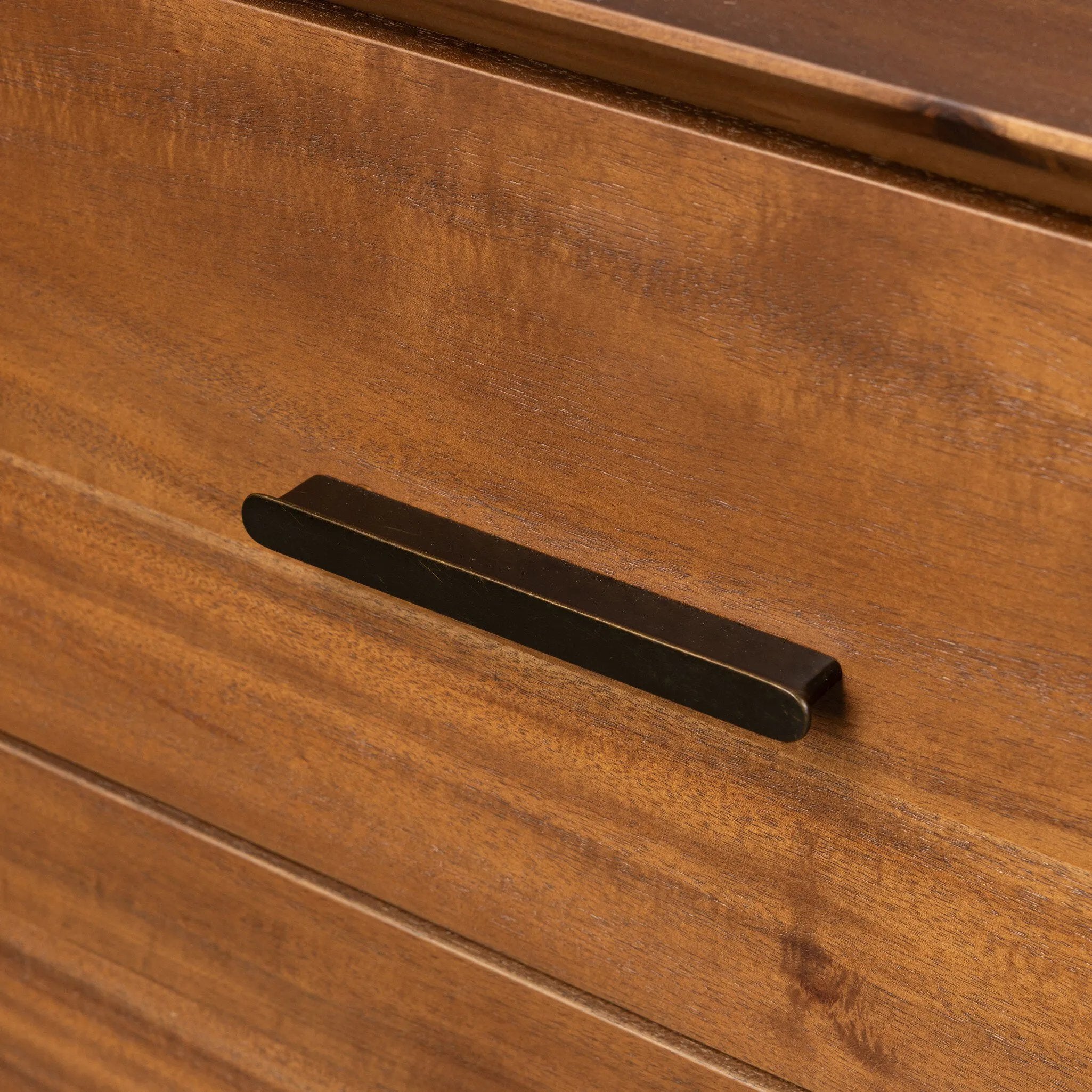 Make a subtle statement in your bedroom with a modern, architectural dresser. An exaggerated pedestal base of solid acacia supports a clean-lined case with nine roomy drawers. Iron hardware in an aged bronze finish the look.As enthusiasts of clean materials at Amethyst, we love the designer inspired Lilas 9 Drawer Dresser - Saddle Tan Veneer. Amethyst Home provides interior design, new home construction design consulting, vintage area rugs, and lighting in the Portland metro area.