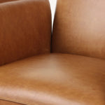 Wrapped in buttery-soft tan top-grain leather, this structured, high-back chair is designed for comfort and style. Stainless steel casters and a 360-degree swivel for ease in the modern workspace Amethyst Home provides interior design, new home construction design consulting, vintage area rugs, and lighting in the Tampa metro area.