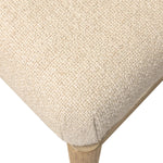 The barrel back dining chair, refreshed. Light oak shapes an armless frame and curved rear legs that almost appear to flow into the seat back. A comfy seat is upholstered in high-performance fabric, while reeding details on the back create a sense of perception play. Amethyst Home provides interior design, new home construction design consulting, vintage area rugs, and lighting in the Park City metro area.