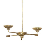 Artfully diffused lighting inspired by 1920s glam. Three glowing discs nestle within curved brass reflectors, creating a warm, expansive ambiance. Reeding detail on the socket and stem add texture, while a hand-burnt brass finish ensures each piece ages uniquely, developing character over time Amethyst Home provides interior design, new home construction design consulting, vintage area rugs, and lighting in the Seattle metro area.