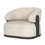 A playful outdoor chair silhouette with a 360 swivel base. The yolk-shaped back is framed by sleek metal accents, adding visual contrast to the exploded boucle upholstery on the thick seat cushion and curved back. Cover or store inside during inclement weather and when not in use. Amethyst Home provides interior design, new home construction design consulting, vintage area rugs, and lighting in the Kansas City metro area.