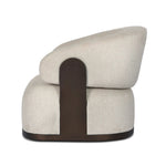 A playful outdoor chair silhouette with a 360 swivel base. The yolk-shaped back is framed by sleek metal accents, adding visual contrast to the exploded boucle upholstery on the thick seat cushion and curved back. Cover or store inside during inclement weather and when not in use. Amethyst Home provides interior design, new home construction design consulting, vintage area rugs, and lighting in the Tampa metro area.