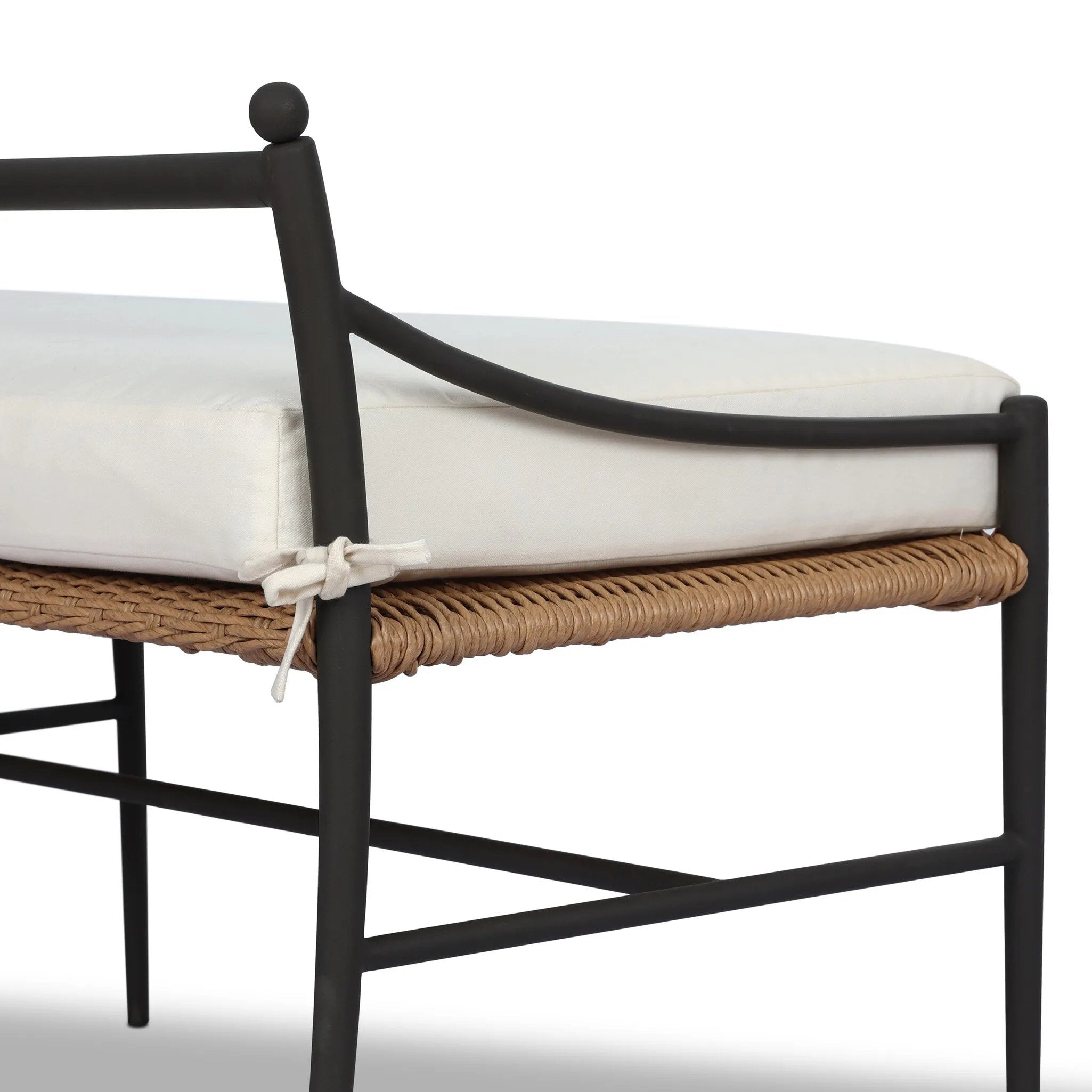 A modern take on traditional weaving patterns centers this outdoor dining bench. Subtly arched metal framing details and a relaxed knife-edge seat cushion invite softness. Cover or store inside during inclement weather and when not in use. A design collaboration by Amber Lewis and Four Hands. Amethyst Home provides interior design, new home construction design consulting, vintage area rugs, and lighting in the Park City metro area.