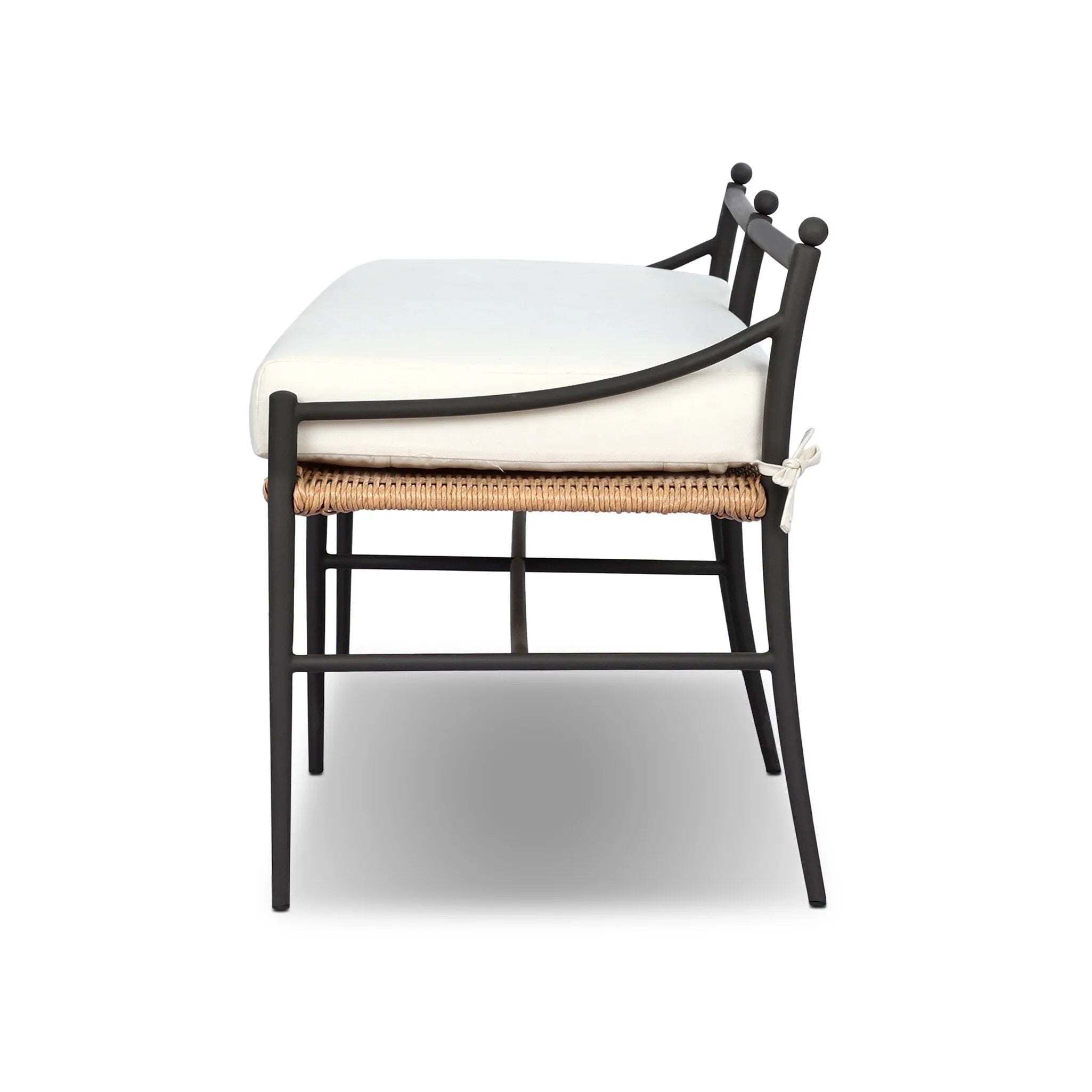 A modern take on traditional weaving patterns centers this outdoor dining bench. Subtly arched metal framing details and a relaxed knife-edge seat cushion invite softness. Cover or store inside during inclement weather and when not in use. A design collaboration by Amber Lewis and Four Hands. Amethyst Home provides interior design, new home construction design consulting, vintage area rugs, and lighting in the San Diego metro area.