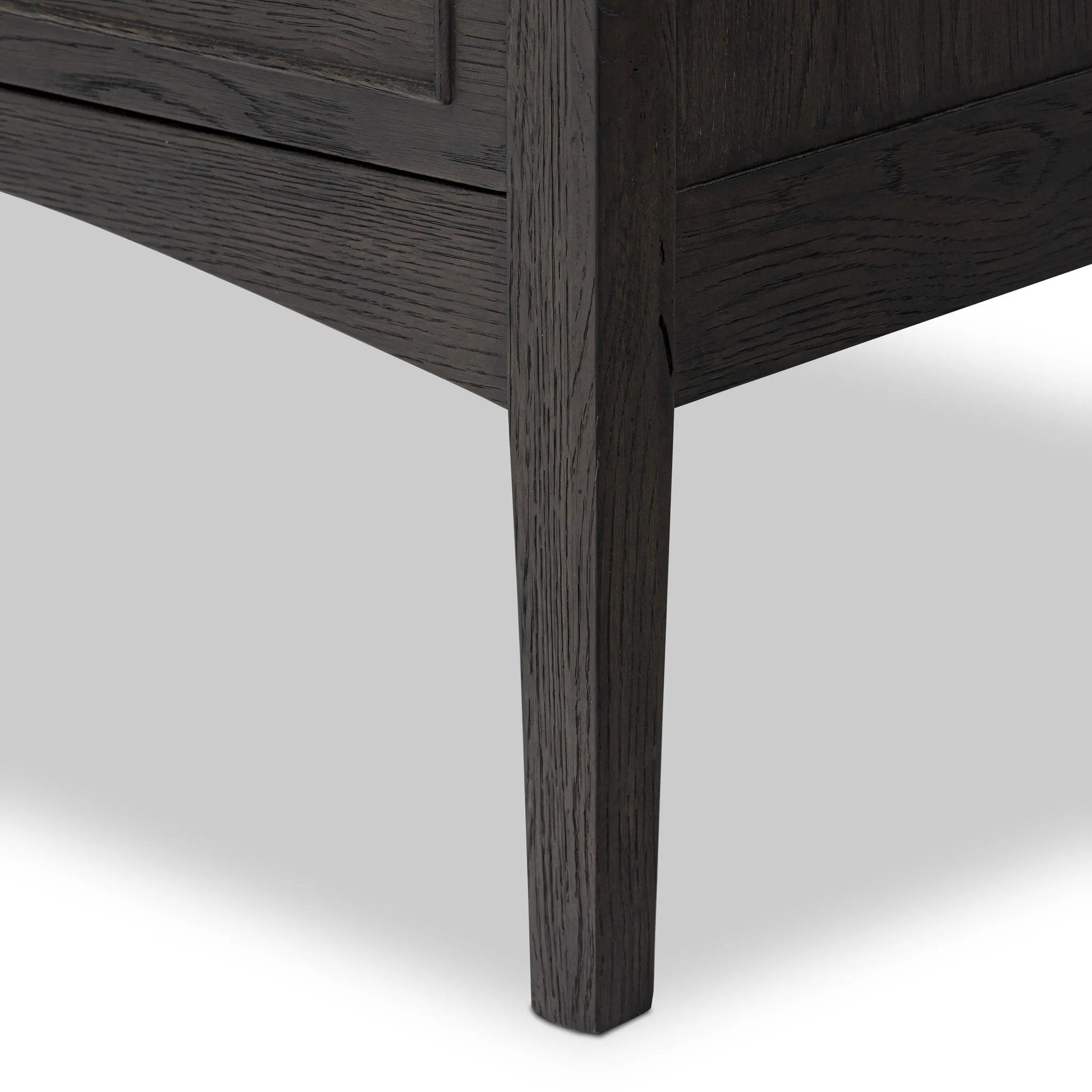 Featuring Maggie Smoked Black Oak Veneer Nightstand by Four Hands at Amethyst Home. Clean and compact, a two-drawer nightstand is crafted from smoked black oak, showcasing the natural grain of wood. Its scaled-down profile fits perfectly beside the bed. Slim, tapered legs add a touch of lightness.Overall Dimensions: 30.00"w x 16.75"d x 26.00"hWeight : 66.14 lb. Amethyst Home provides interior design, new home construction design consulting, vintage area rugs, and lighting in the Dallas metro area.