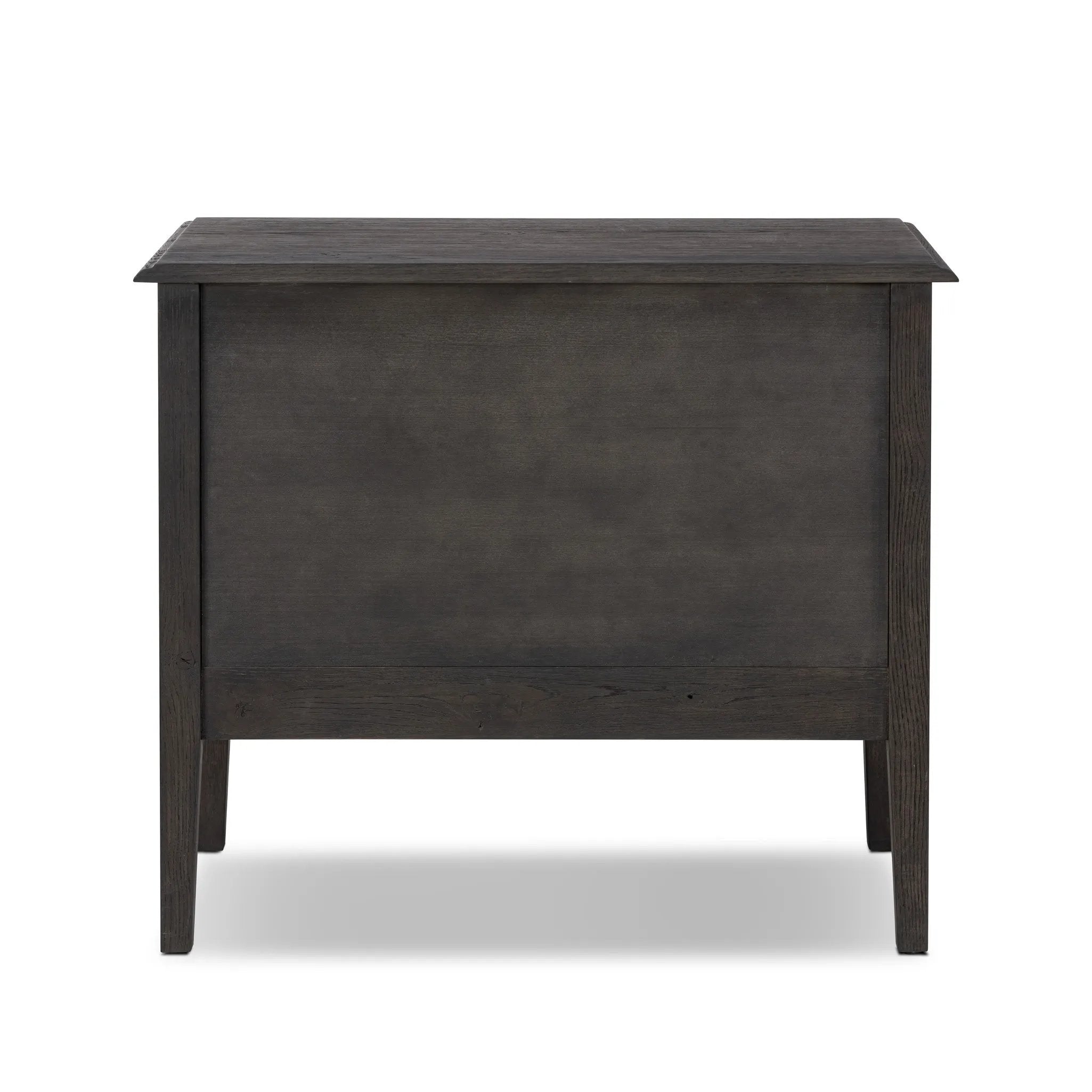 Featuring Maggie Smoked Black Oak Veneer Nightstand by Four Hands at Amethyst Home. Clean and compact, a two-drawer nightstand is crafted from smoked black oak, showcasing the natural grain of wood. Its scaled-down profile fits perfectly beside the bed. Slim, tapered legs add a touch of lightness.Overall Dimensions: 30.00"w x 16.75"d x 26.00"hWeight : 66.14 lbs. Amethyst Home provides interior design, new home construction design consulting, vintage area rugs, and lighting in the Tampa metro area.