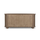 A smaller scale and antique-inspired oval shape give this sideboard a classic polished look. A slight overhang of the top and bottom slabs adds visual interest, while simple ball-shaped hardware mimics this sideboard's unique bun feet. Amethyst Home provides interior design, new home construction design consulting, vintage area rugs, and lighting in the Calabasas metro area.