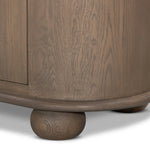 A smaller scale and antique-inspired oval shape give this sideboard a classic polished look. A slight overhang of the top and bottom slabs adds visual interest, while simple ball-shaped hardware mimics this sideboard's unique bun feet. Amethyst Home provides interior design, new home construction design consulting, vintage area rugs, and lighting in the Nashville metro area.