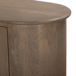 A smaller scale and antique-inspired oval shape give this sideboard a classic polished look. A slight overhang of the top and bottom slabs adds visual interest, while simple ball-shaped hardware mimics this sideboard's unique bun feet. Amethyst Home provides interior design, new home construction design consulting, vintage area rugs, and lighting in the Tampa metro area.