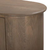 A smaller scale and antique-inspired oval shape give this sideboard a classic polished look. A slight overhang of the top and bottom slabs adds visual interest, while simple ball-shaped hardware mimics this sideboard's unique bun feet. Amethyst Home provides interior design, new home construction design consulting, vintage area rugs, and lighting in the Tampa metro area.