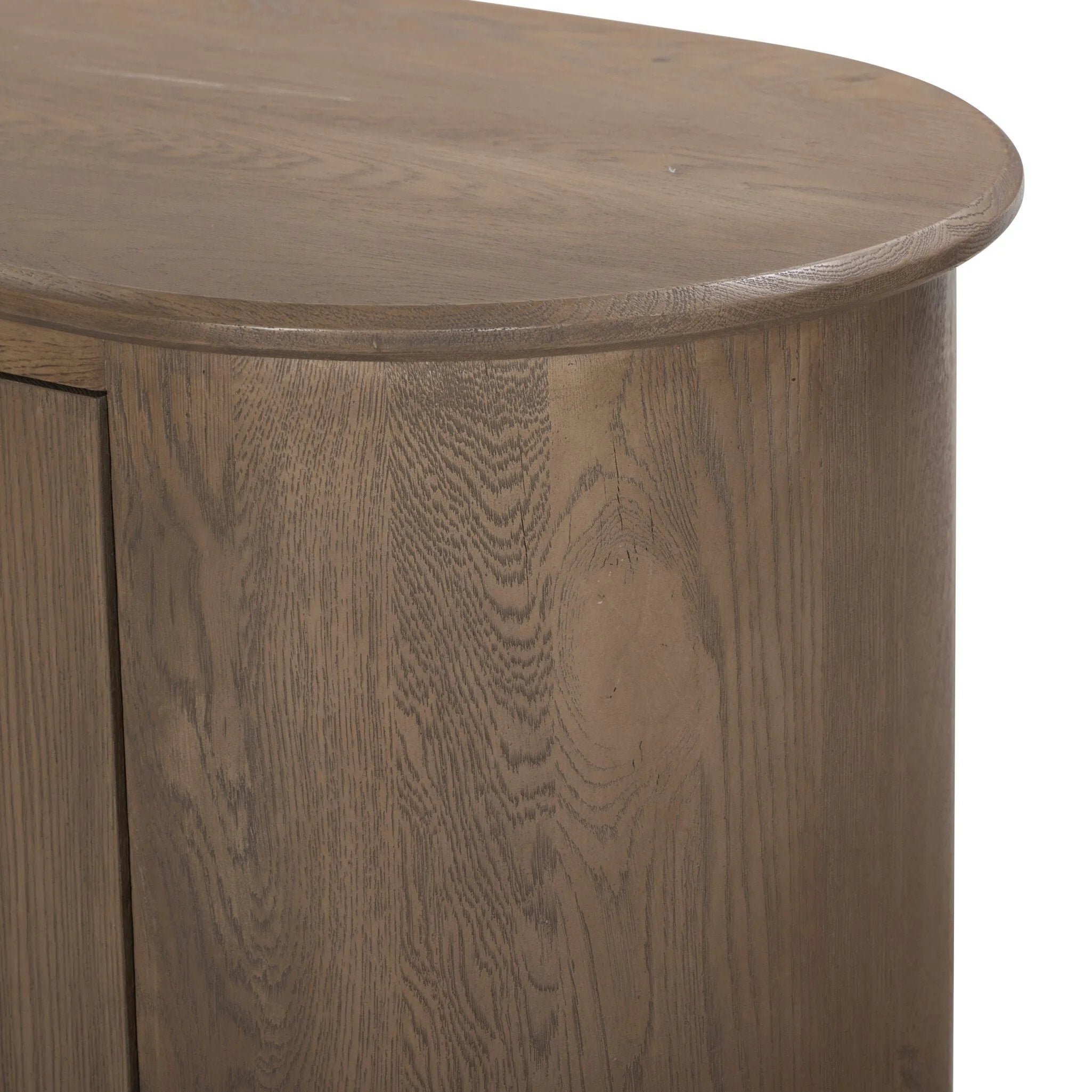 A smaller scale and antique-inspired oval shape give this sideboard a classic polished look. A slight overhang of the top and bottom slabs adds visual interest, while simple ball-shaped hardware mimics this sideboard's unique bun feet. Amethyst Home provides interior design, new home construction design consulting, vintage area rugs, and lighting in the Tampa metro area.
