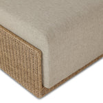 A fresh, playful take on the outdoor ottoman, featuring a woven cradle frame that wraps around the deep upholstered seat for added texture, dimension and contrast. The cushion is intentionally firm for a structured feel, meaning this piece can also be used as a coffee table. Cover or store inside during inclement weather and when not in use. Amethyst Home provides interior design, new home construction design consulting, vintage area rugs, and lighting in the Calabasas metro area.