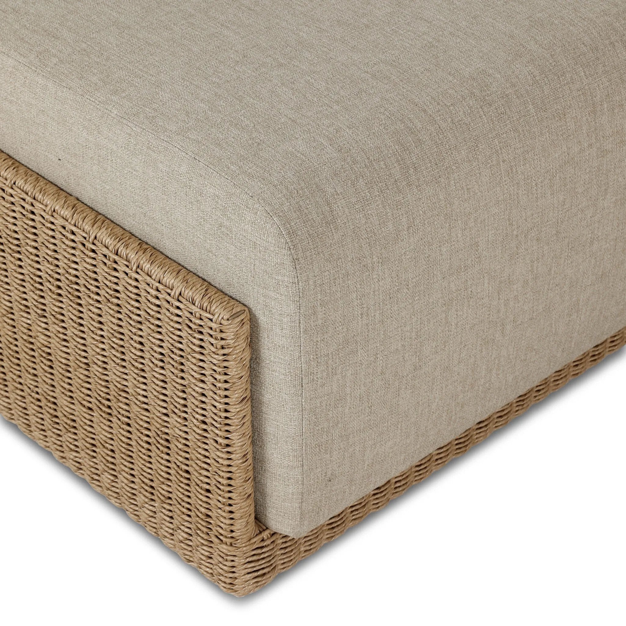 A fresh, playful take on the outdoor ottoman, featuring a woven cradle frame that wraps around the deep upholstered seat for added texture, dimension and contrast. The cushion is intentionally firm for a structured feel, meaning this piece can also be used as a coffee table. Cover or store inside during inclement weather and when not in use. Amethyst Home provides interior design, new home construction design consulting, vintage area rugs, and lighting in the Calabasas metro area.