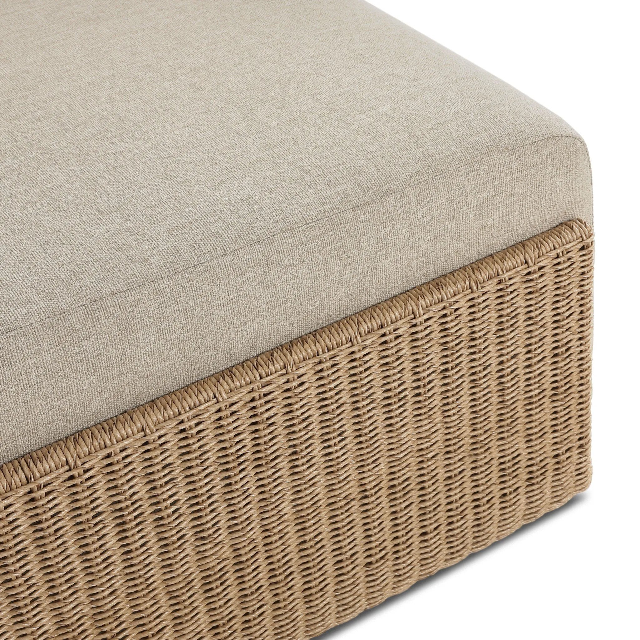 A fresh, playful take on the outdoor ottoman, featuring a woven cradle frame that wraps around the deep upholstered seat for added texture, dimension and contrast. The cushion is intentionally firm for a structured feel, meaning this piece can also be used as a coffee table. Cover or store inside during inclement weather and when not in use. Amethyst Home provides interior design, new home construction design consulting, vintage area rugs, and lighting in the Scottsdale metro area.